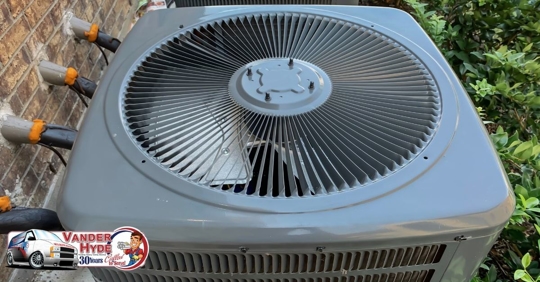 The outdoor unit of an ac condenser viewed from the top