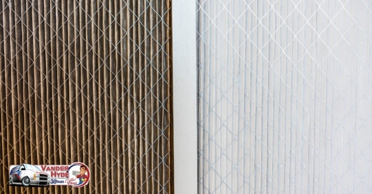 A dirty air filter on the left and a clean air filter on the right